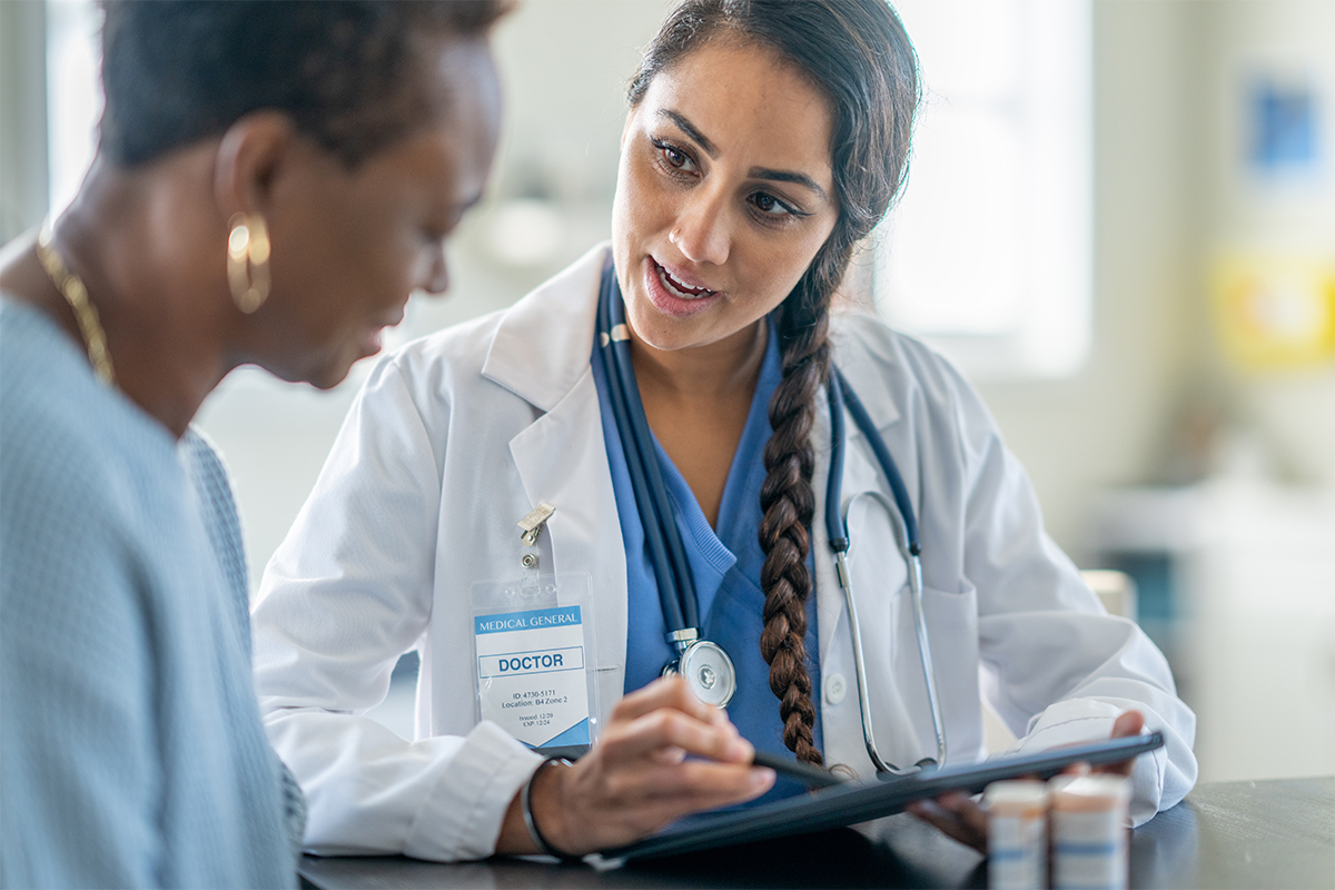 Female doctor speaks to her patient