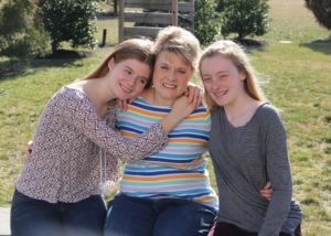 Paige Sherman (center) with her daughters Sydney (left) and Lindsay (right)