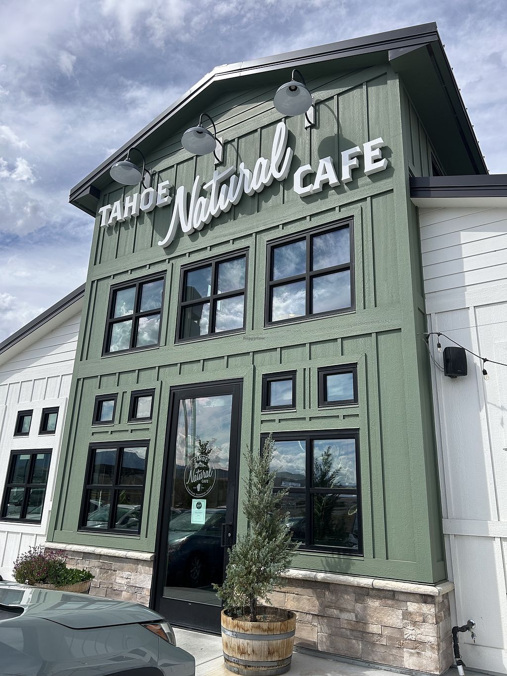 Large green building labeled Tahoe Natural Cafe