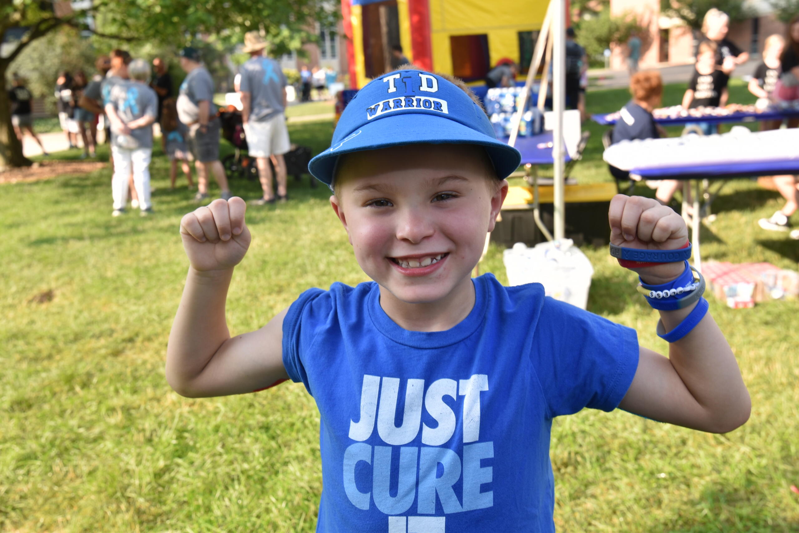 child in breakthrough t1d shirt and hat