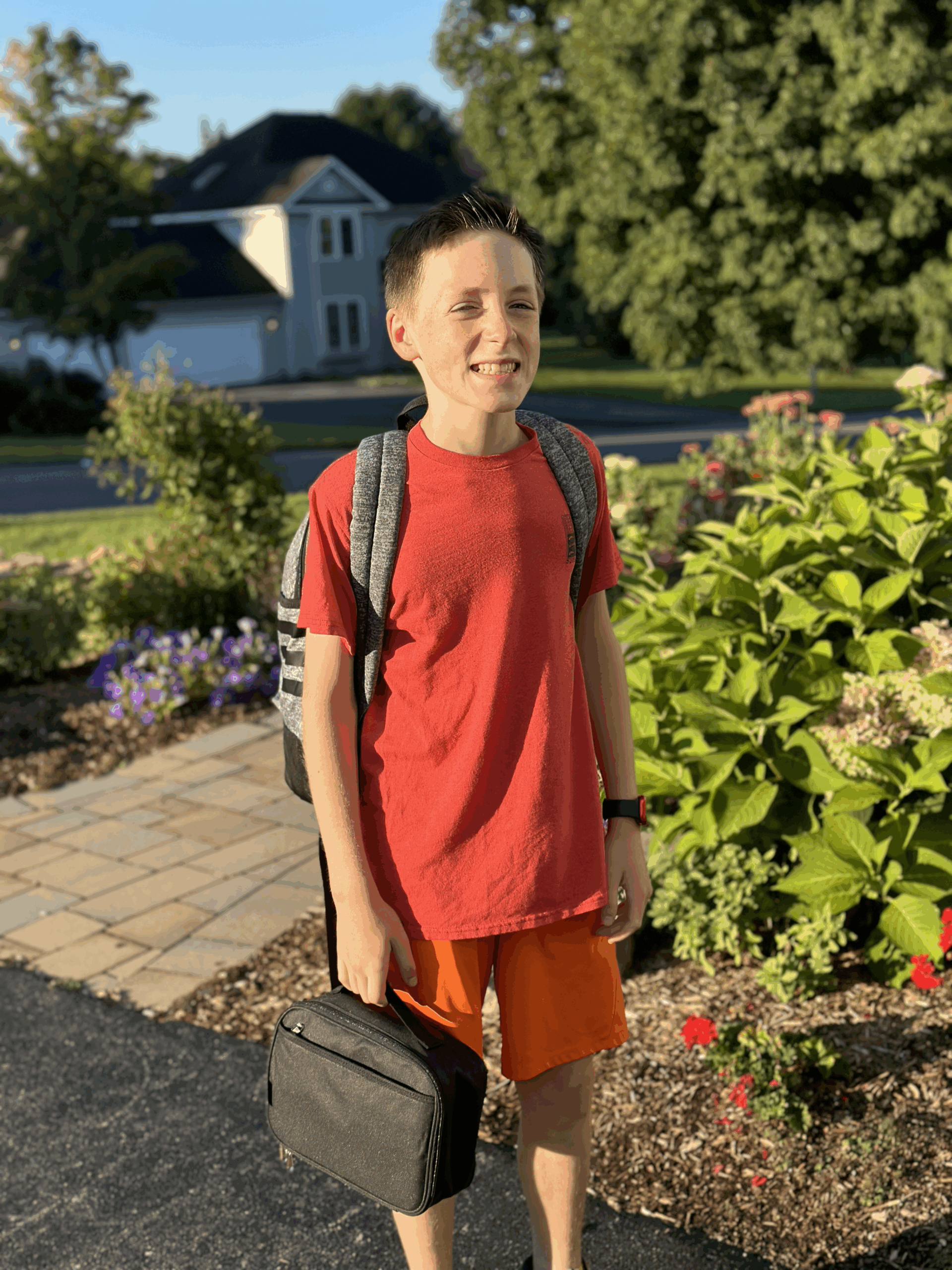 Henry, a young boy, wearing a red t-shirt