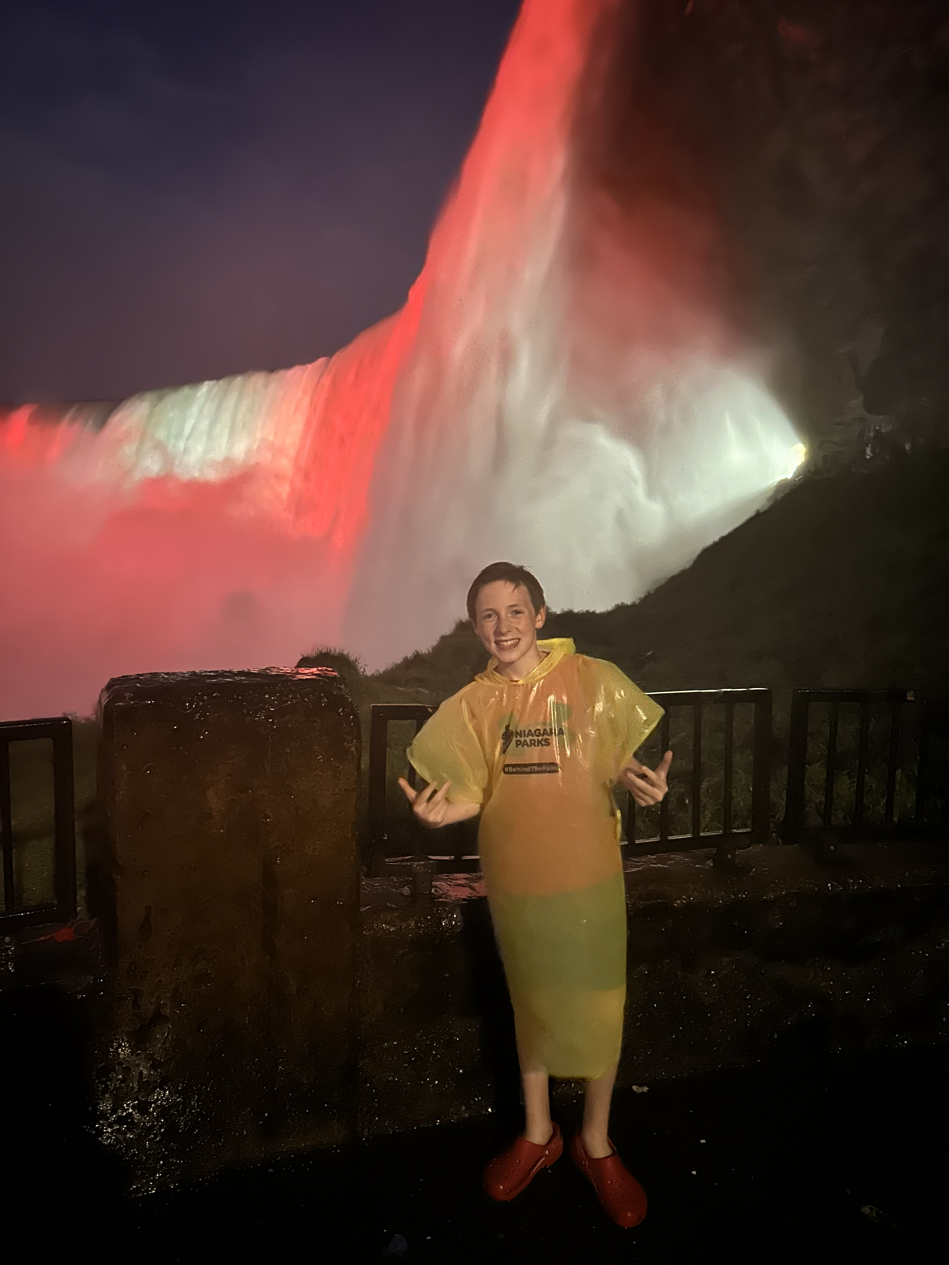 Henry stands in front of Niagara Falls in NY