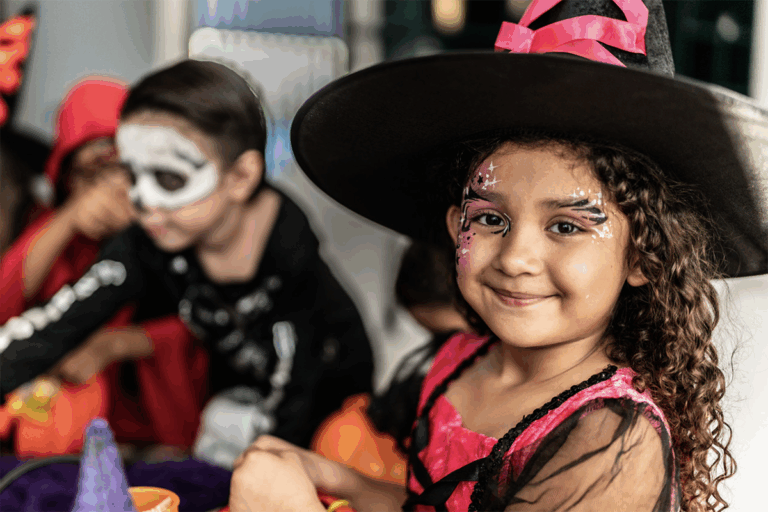 Young girl in a costume at a Halloween party