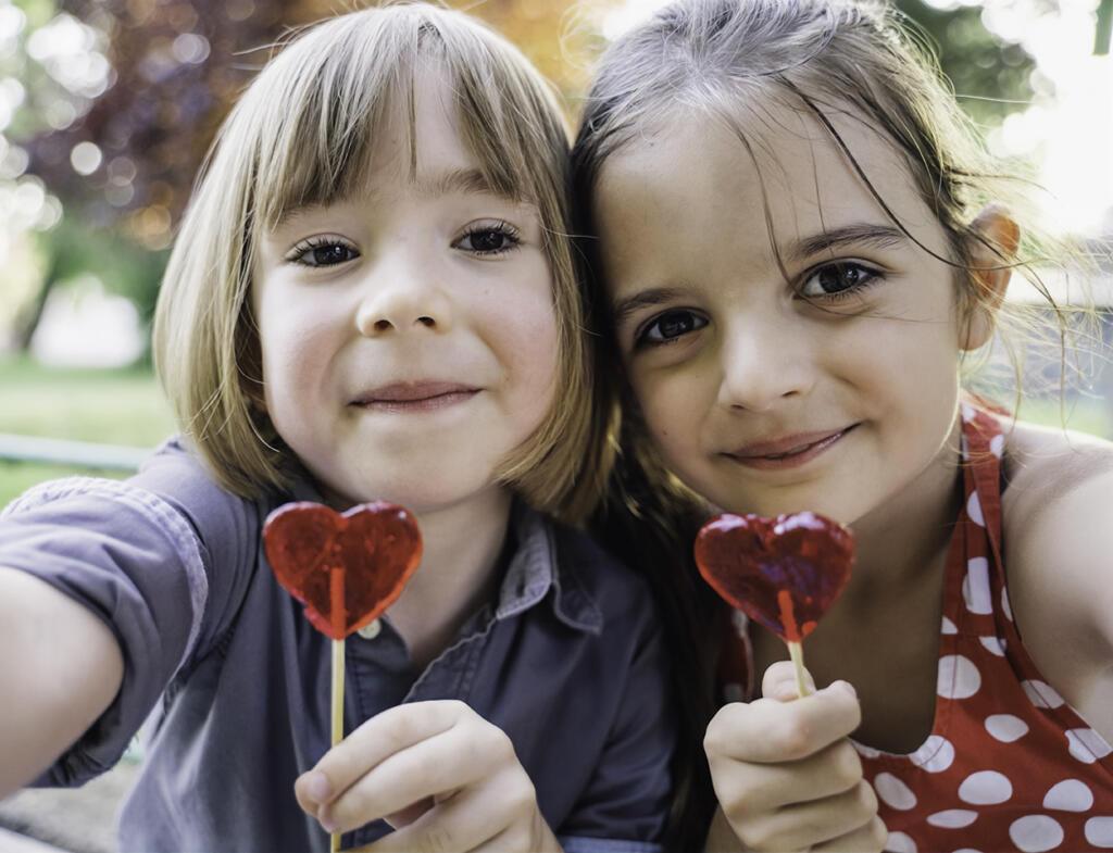 Two young friends enjoy a Valentine's Day treat together