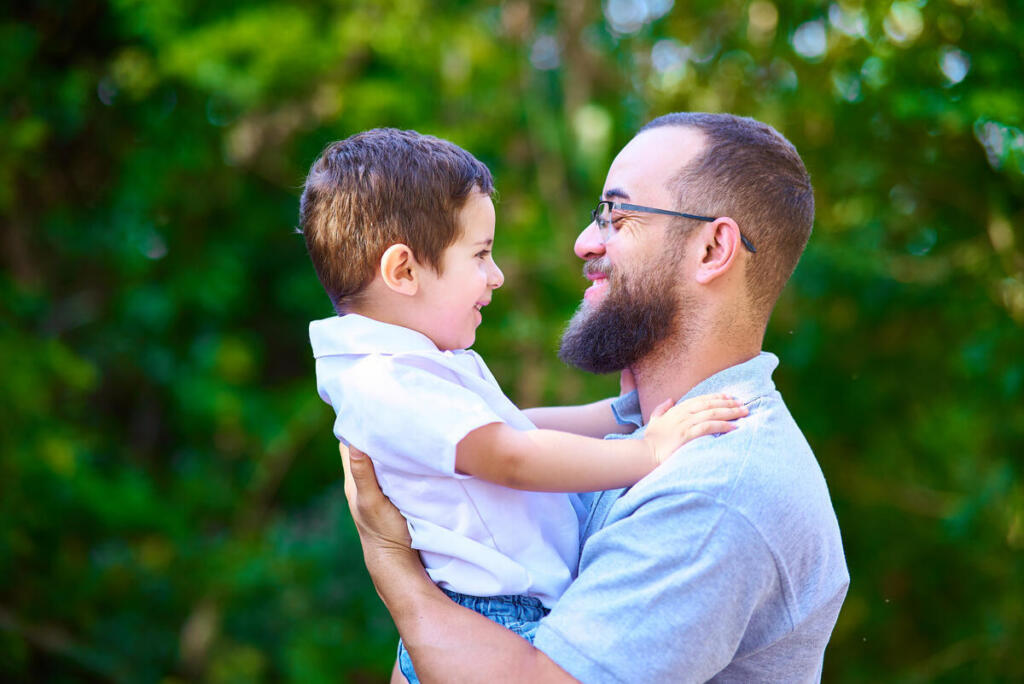 Portrait of a little boy with type 1 diabetes and his dad
