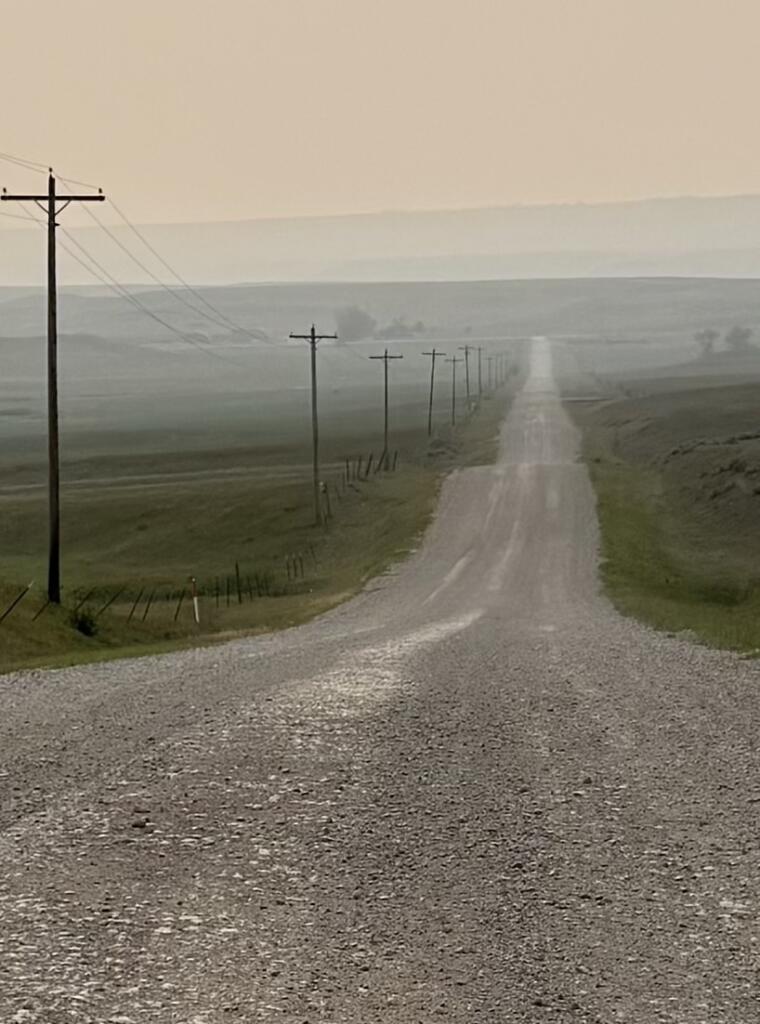 A rural highway stretches into the distance.